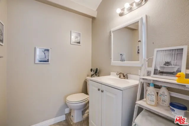 a view of a bathroom with sink and a toilet