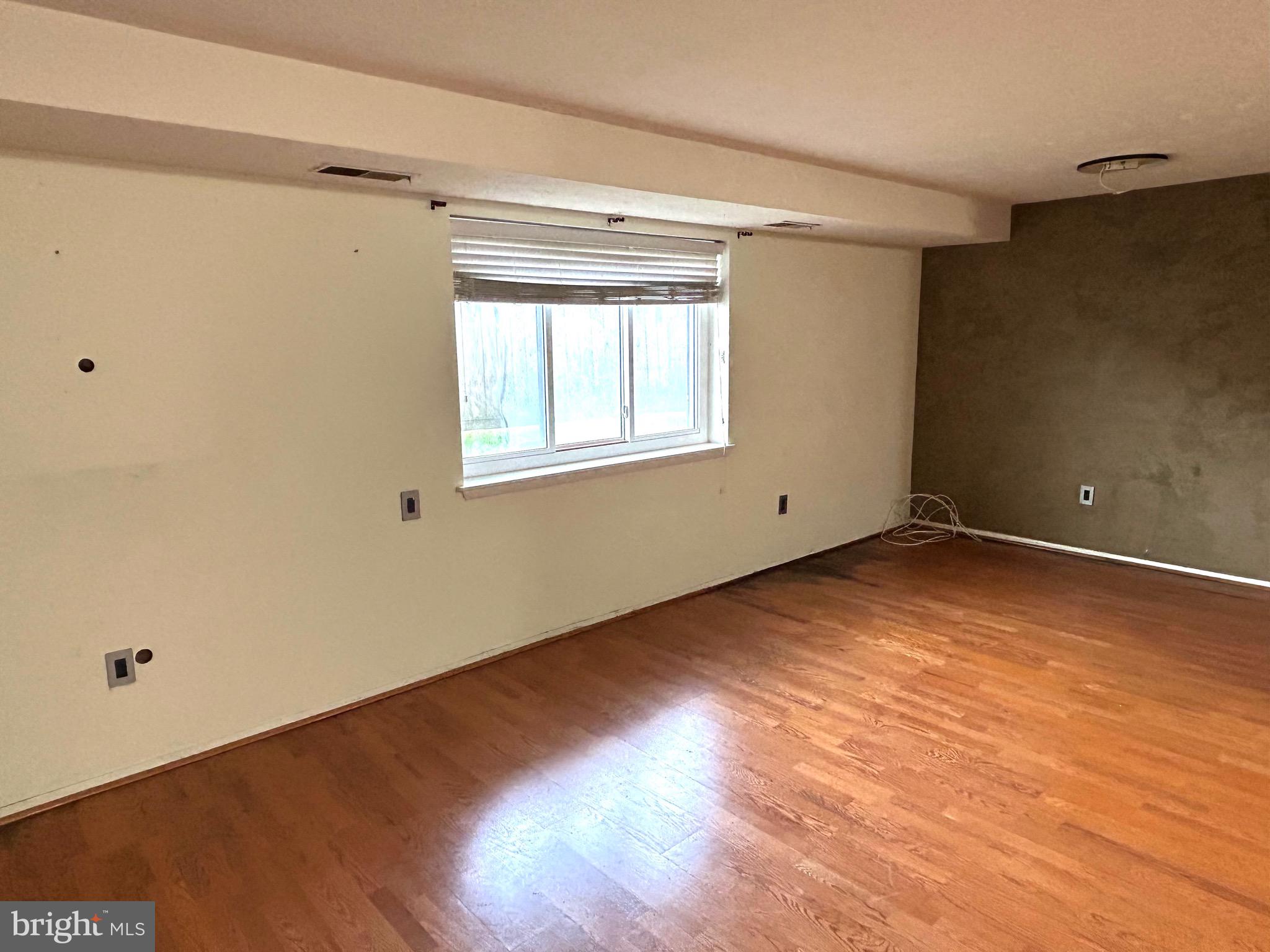 12405 Hickory Tree Way, Unit 613 Germantown, MD 20874 - Photo 32 of 39 a view of empty room with wooden floor and fan