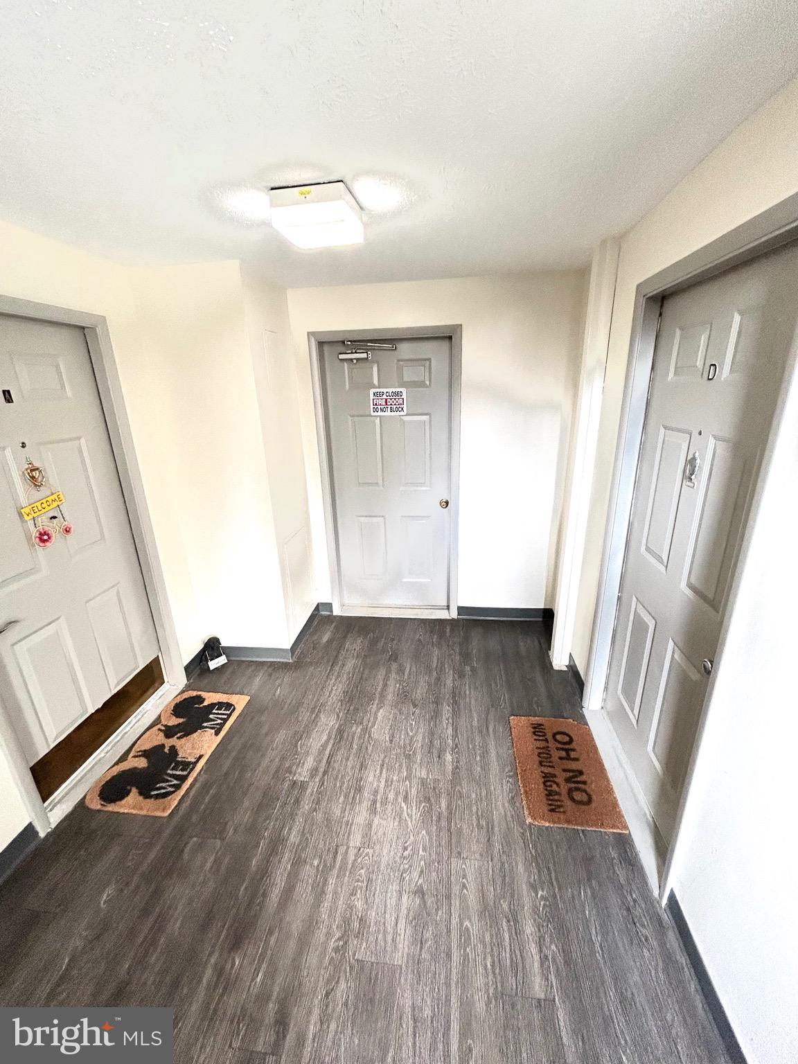 12405 Hickory Tree Way, Unit 613 Germantown, MD 20874 - Photo 7 of 22 a view of wooden floor in a room