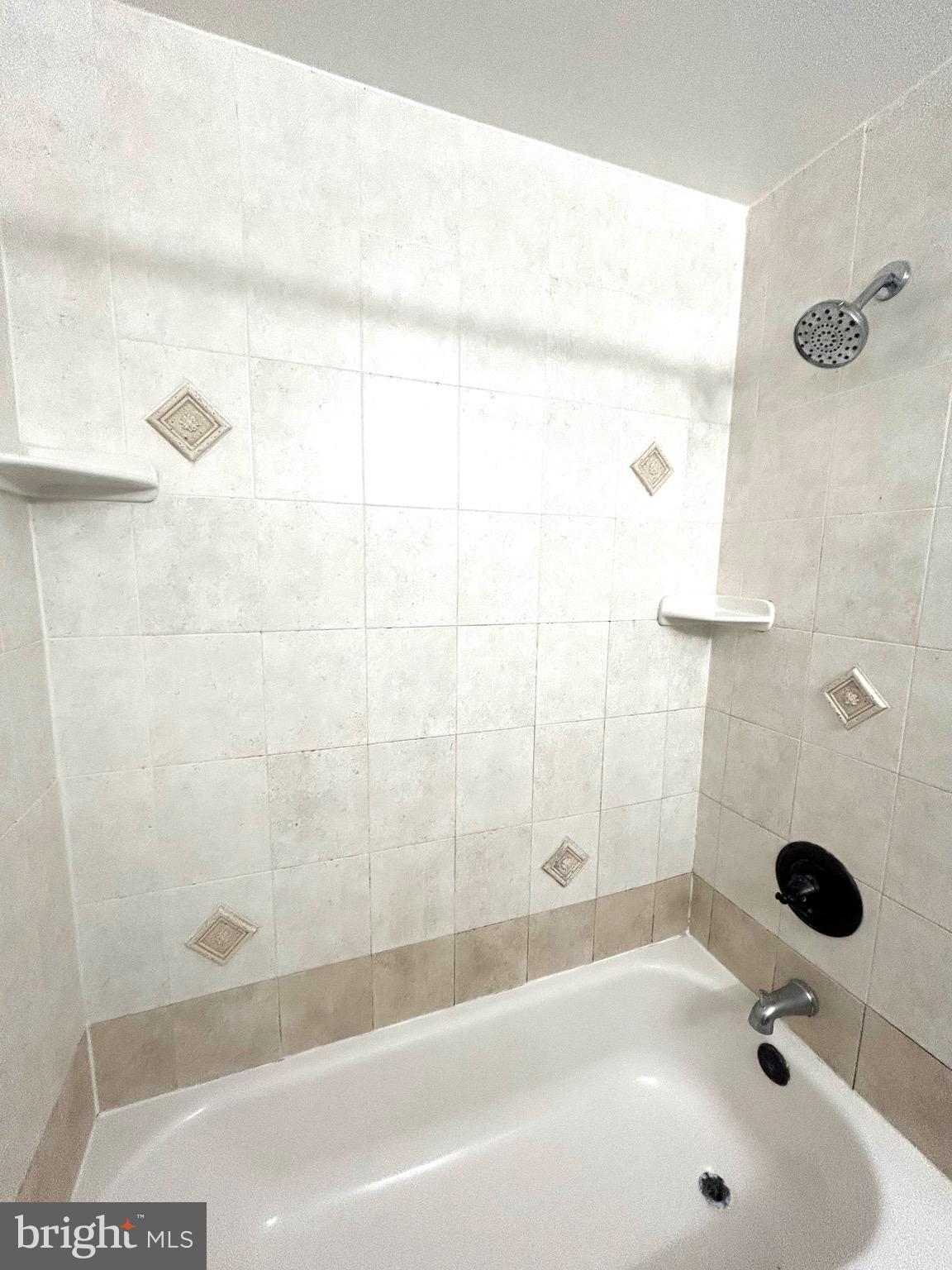 12405 Hickory Tree Way, Unit 613 Germantown, MD 20874 - Photo 9 of 39 a bathroom with a tub