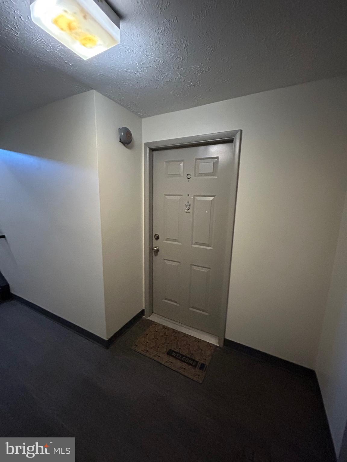 12405 Hickory Tree Way, Unit 613 Germantown, MD 20874 - Photo 10 of 39 an empty room with a empty space and a window
