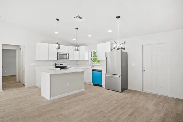a view of a kitchen with a sink