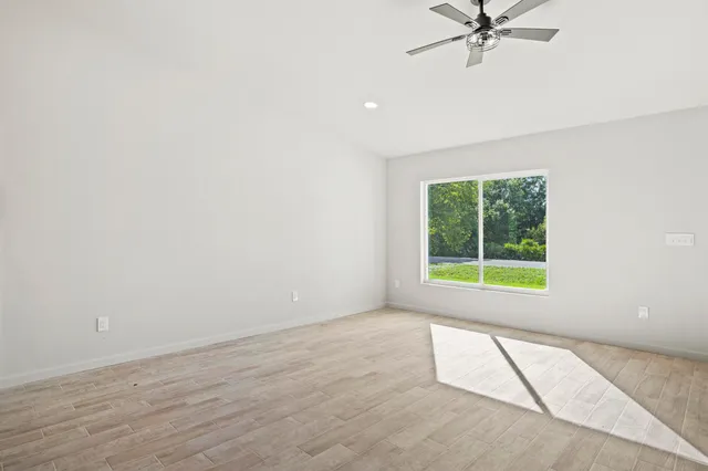 a view of an empty room with a window