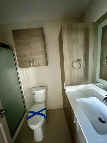 a bathroom with a sink and a large mirror