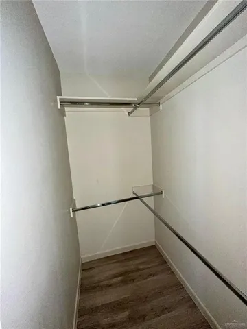 a view of an empty walk in closet