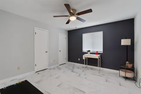 a workspace with furniture and a window