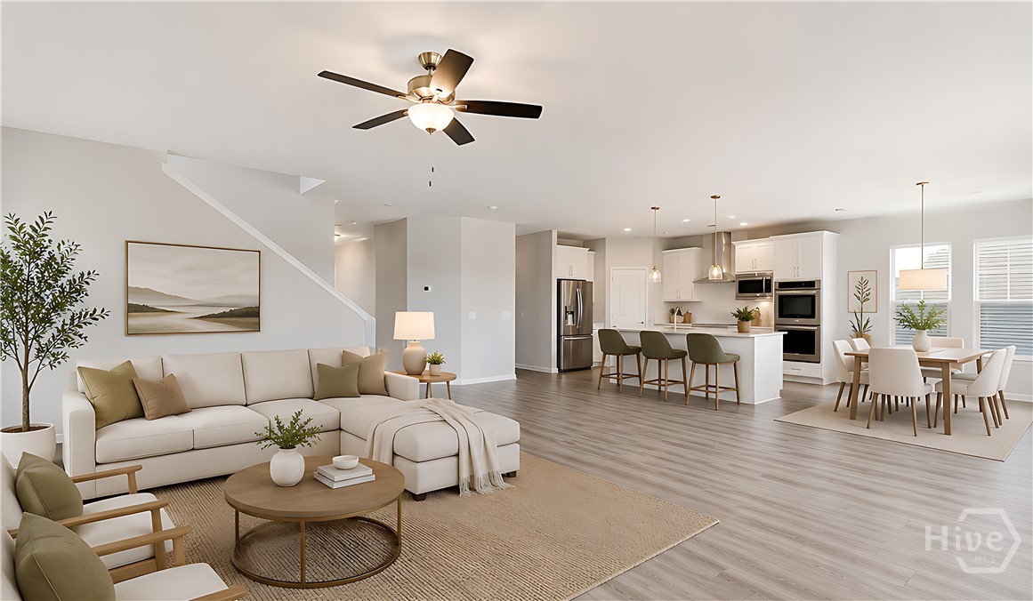 107 Como Drive Pooler, GA 31322 - Photo 7 of 23 Galley kitchen flowing into a staged living area