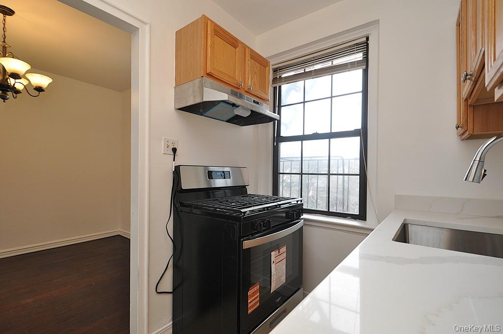 180 Garth Road, Unit 4F Scarsdale, NY 10583 - Photo 12 of 39 Kitchen has Quarts counters and stainless steel appliances