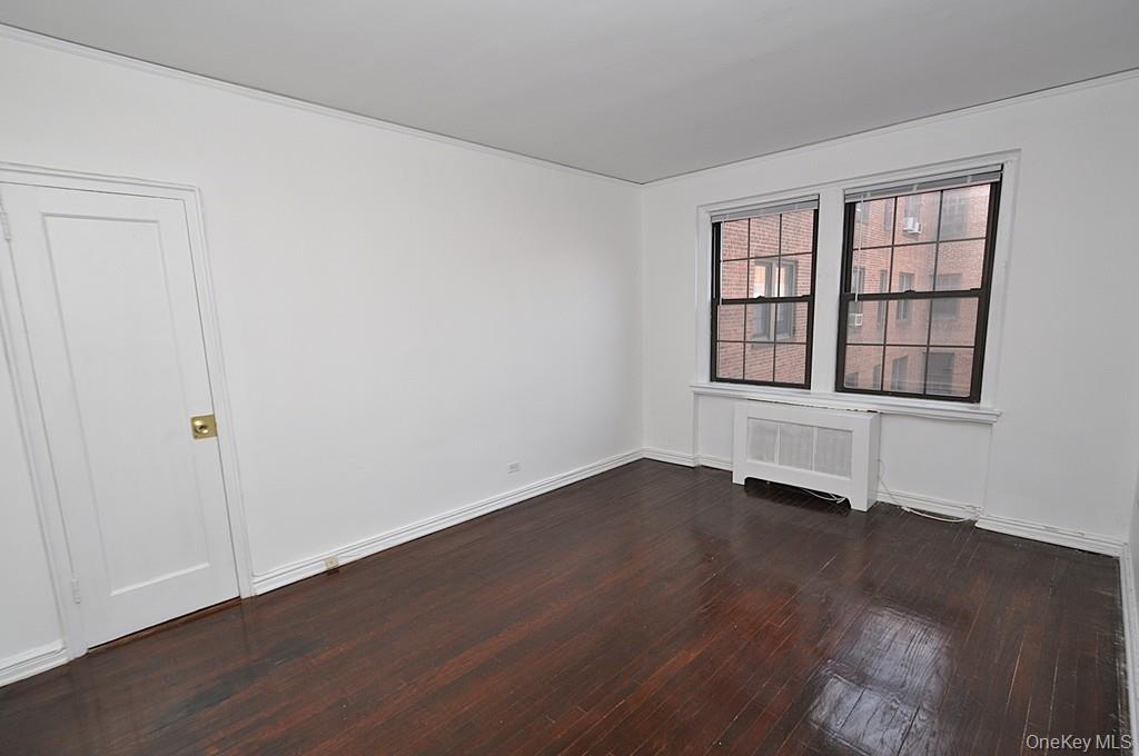 180 Garth Road, Unit 4F Scarsdale, NY 10583 - Photo 20 of 39 Bedroom overlooks the manicured courtyard and has hardwood floors. The bedroom is approx. 14'-10" x 10'-11".