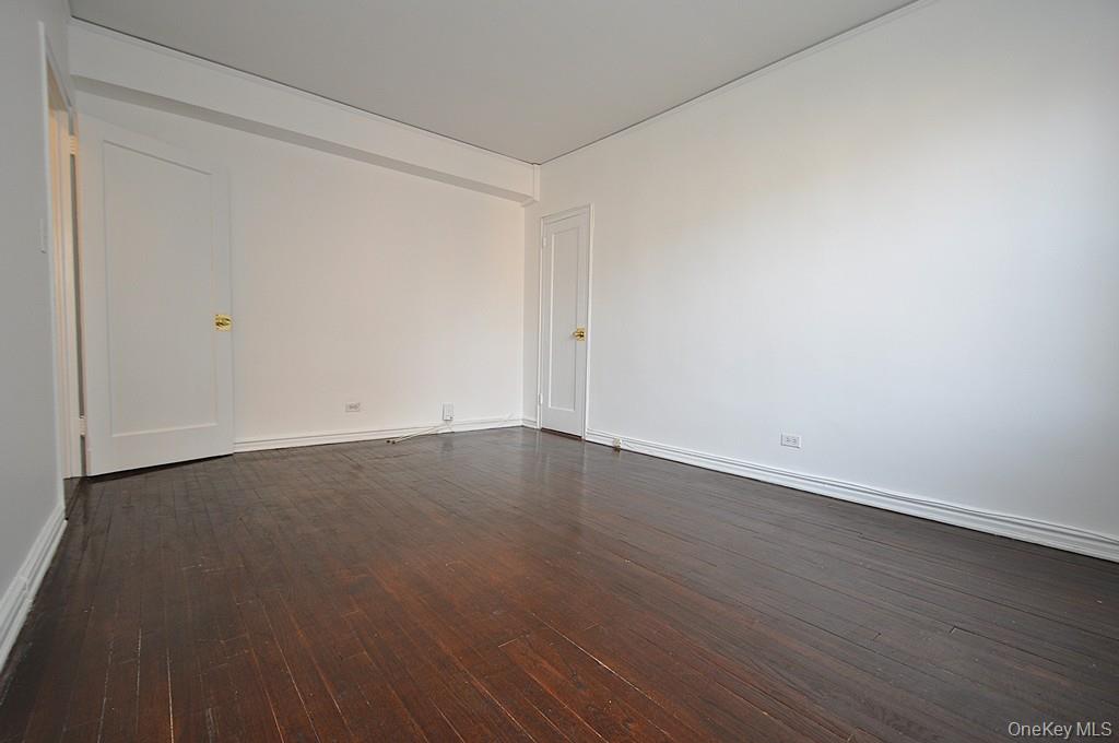 180 Garth Road, Unit 4F Scarsdale, NY 10583 - Photo 23 of 39 Bedroom overlooks the manicured courtyard and has hardwood floors. The bedroom is approx. 14'-10" x 10'-11".