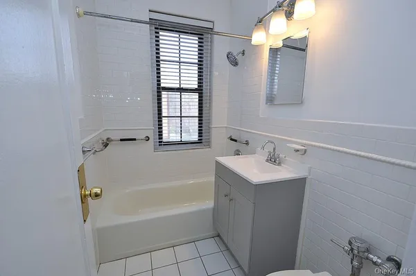 a bathroom with a sink a bathtub and a shower