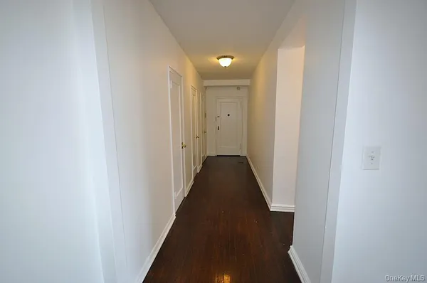 a view of a hallway with a door