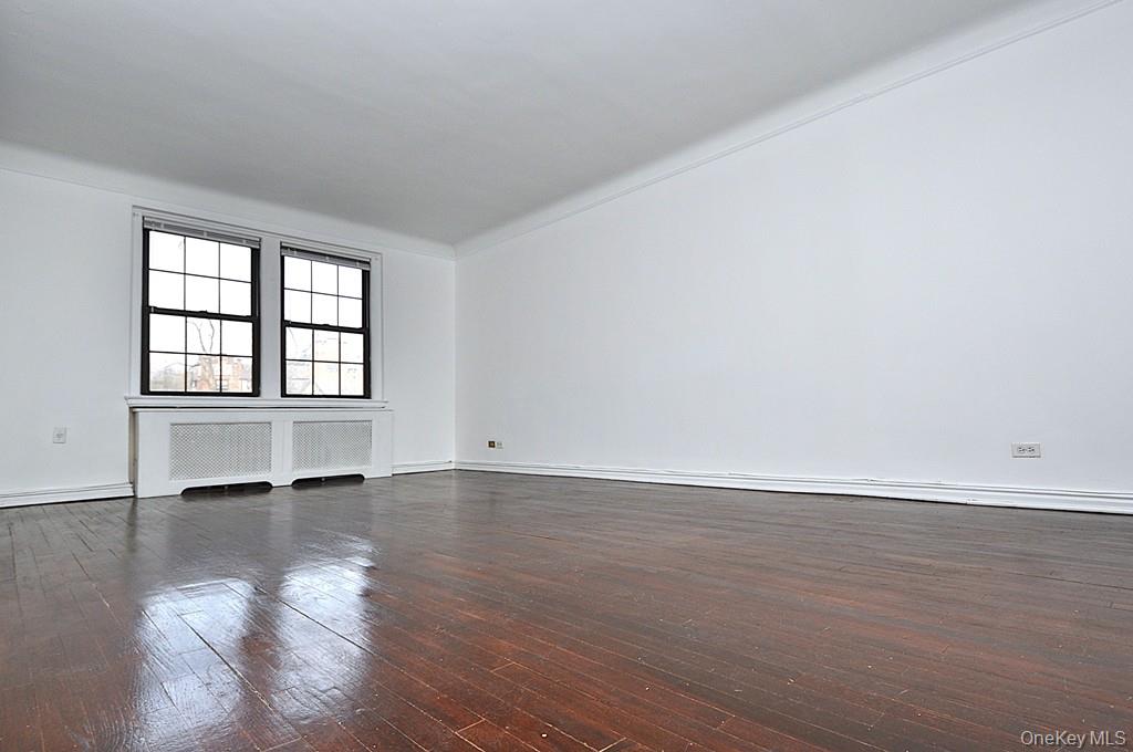 180 Garth Road, Unit 4F Scarsdale, NY 10583 - Photo 8 of 39 The large living room has hardwood floors, overlooks the manicured courtyard and opens to the dining room. The living room is approx. 19'-9" x 12'7".