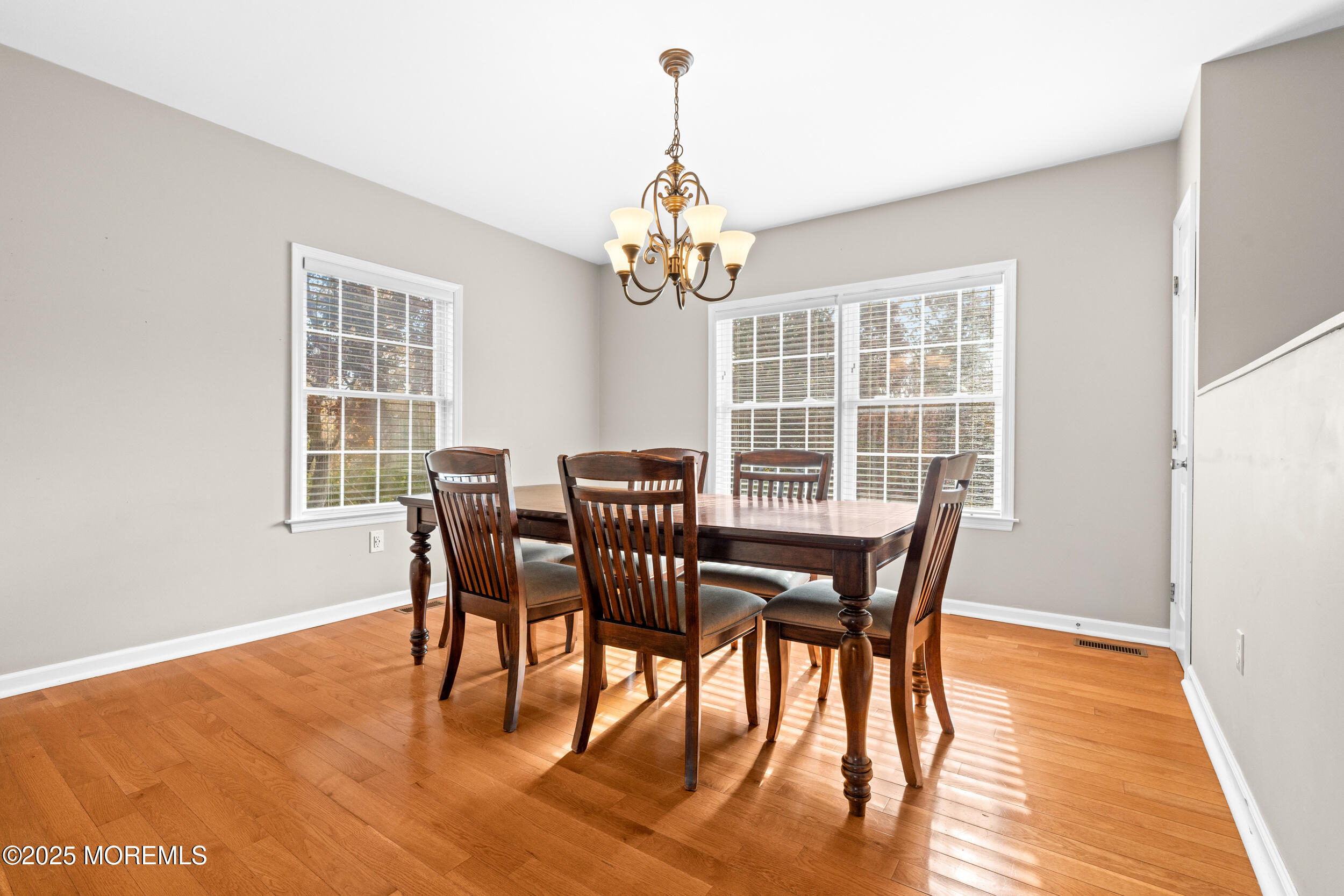 603 West Farms Road Howell, NJ 07731 - Photo 17 of 38 a view of a dining room with furniture window and wooden floor
