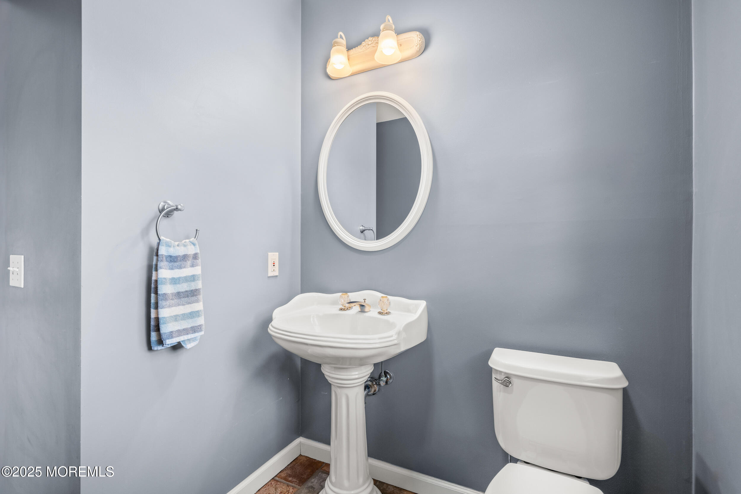 603 West Farms Road Howell, NJ 07731 - Photo 19 of 38 a bathroom with a toilet sink and mirror