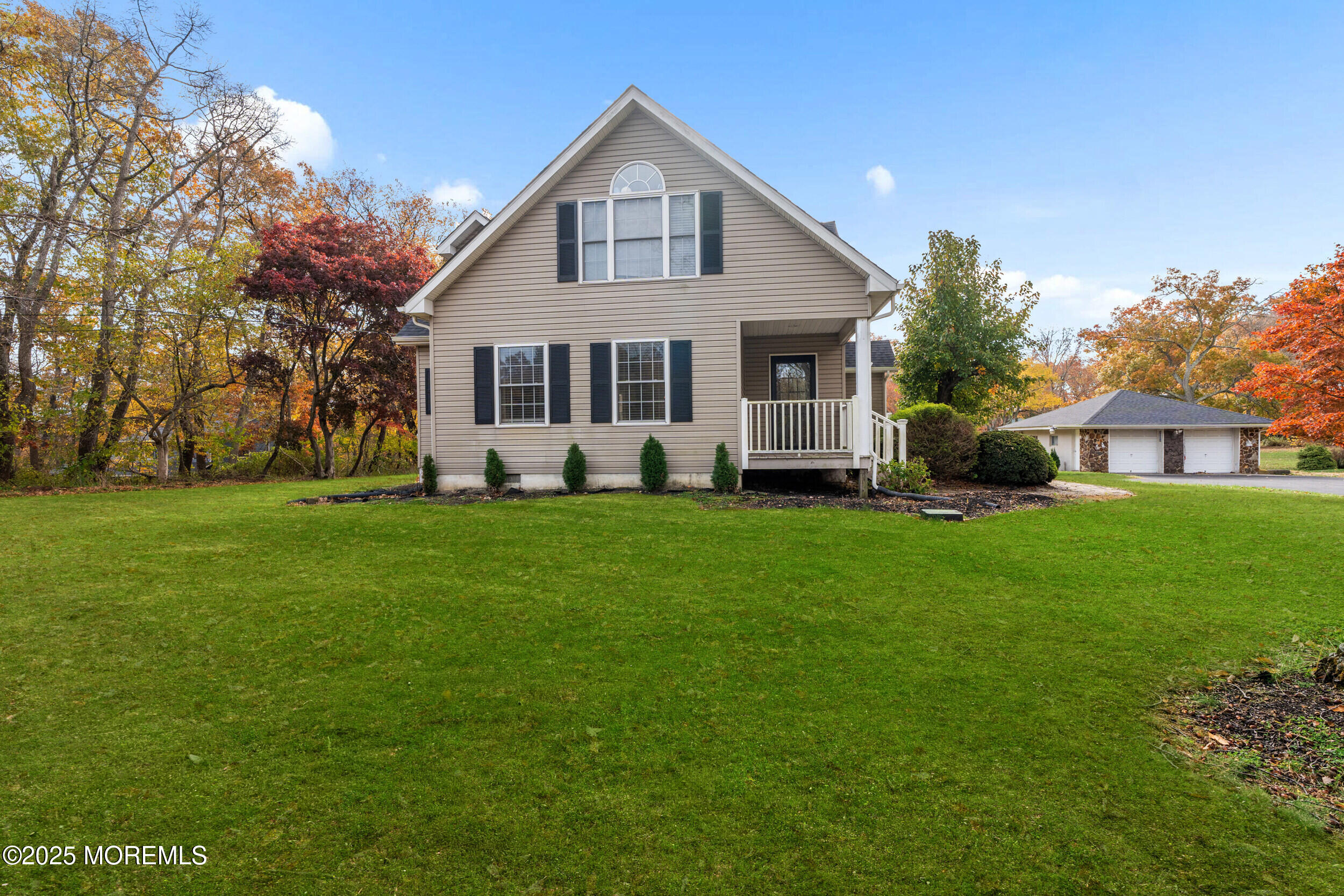 603 West Farms Road Howell, NJ 07731 - Photo 2 of 38 a front view of house with yard and green space