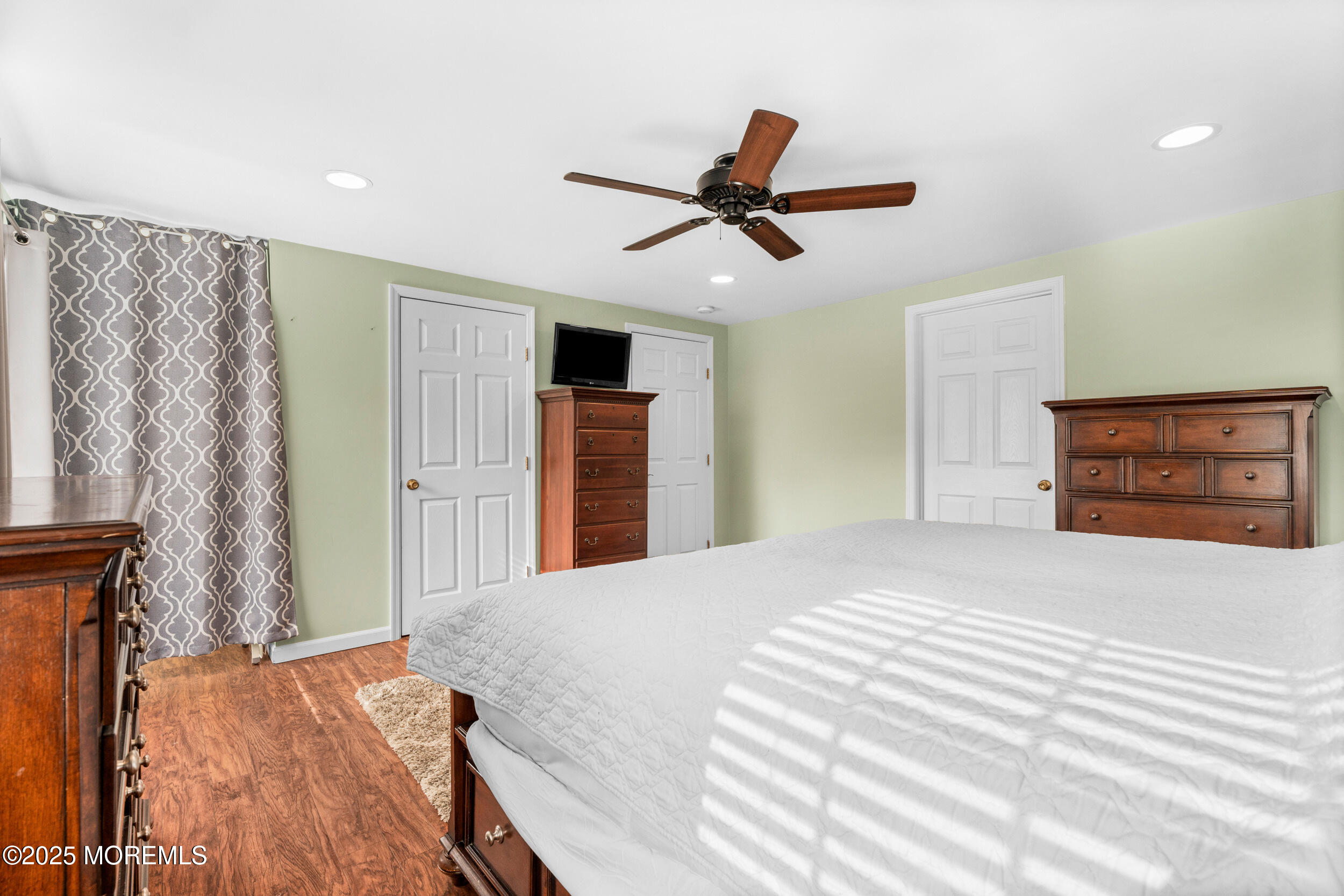 603 West Farms Road Howell, NJ 07731 - Photo 26 of 38 a bedroom with a bed and a painting on the wall