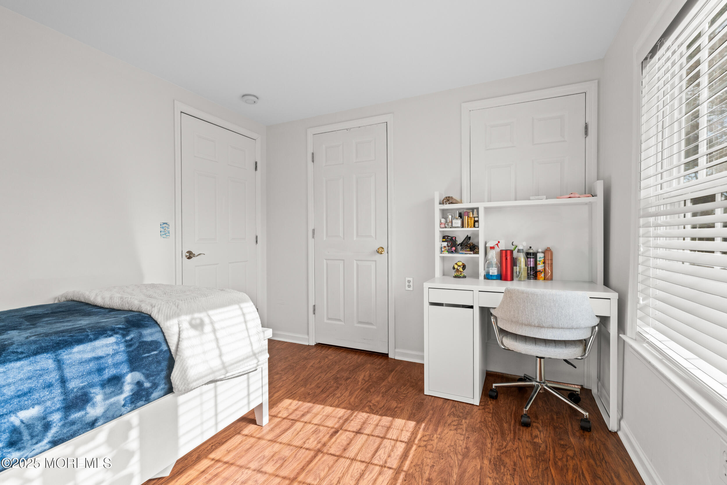 603 West Farms Road Howell, NJ 07731 - Photo 29 of 38 a room that has a bed and a chair in it