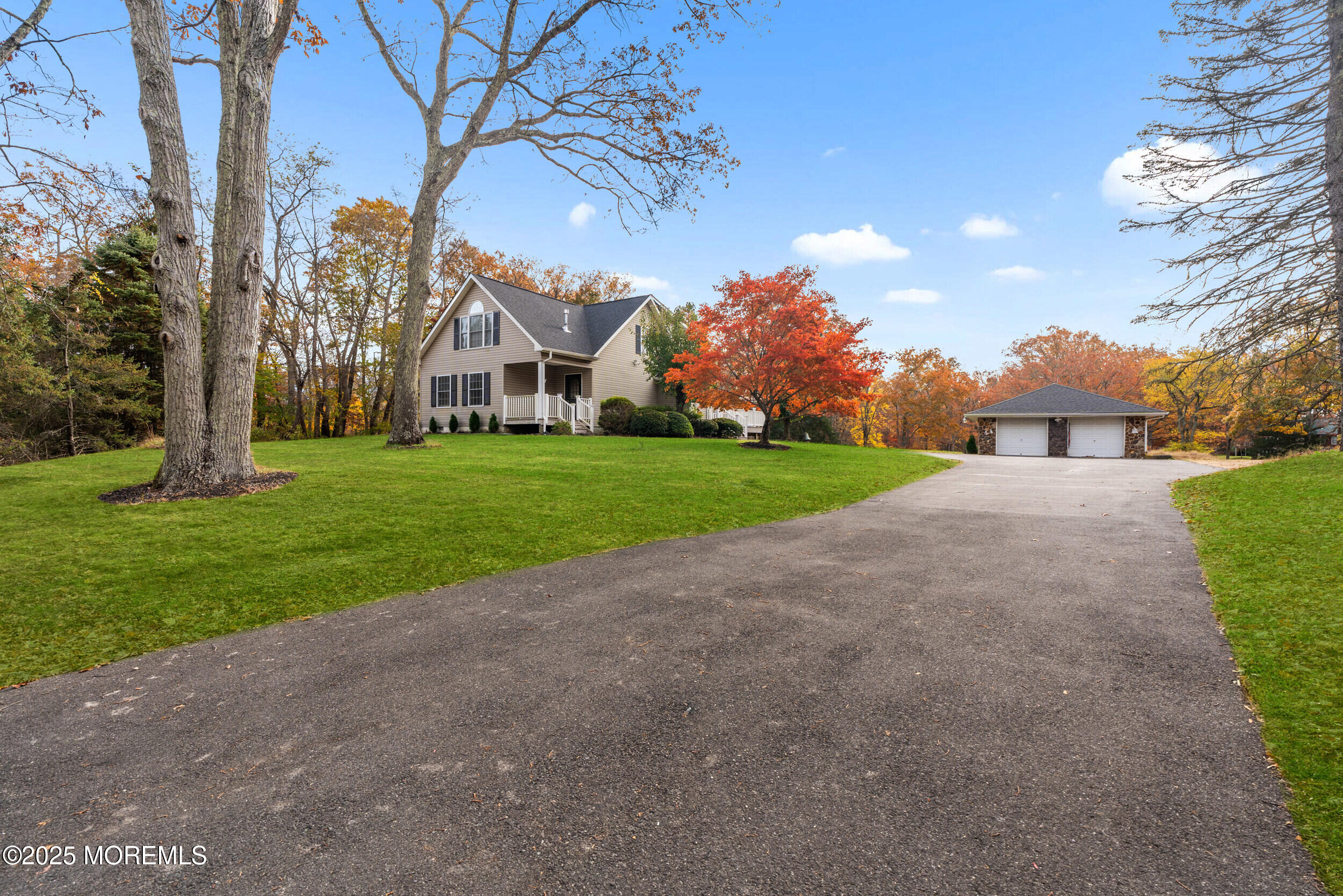 603 West Farms Road Howell, NJ 07731 - Photo 37 of 38 a view of a big house with a big yard and large trees