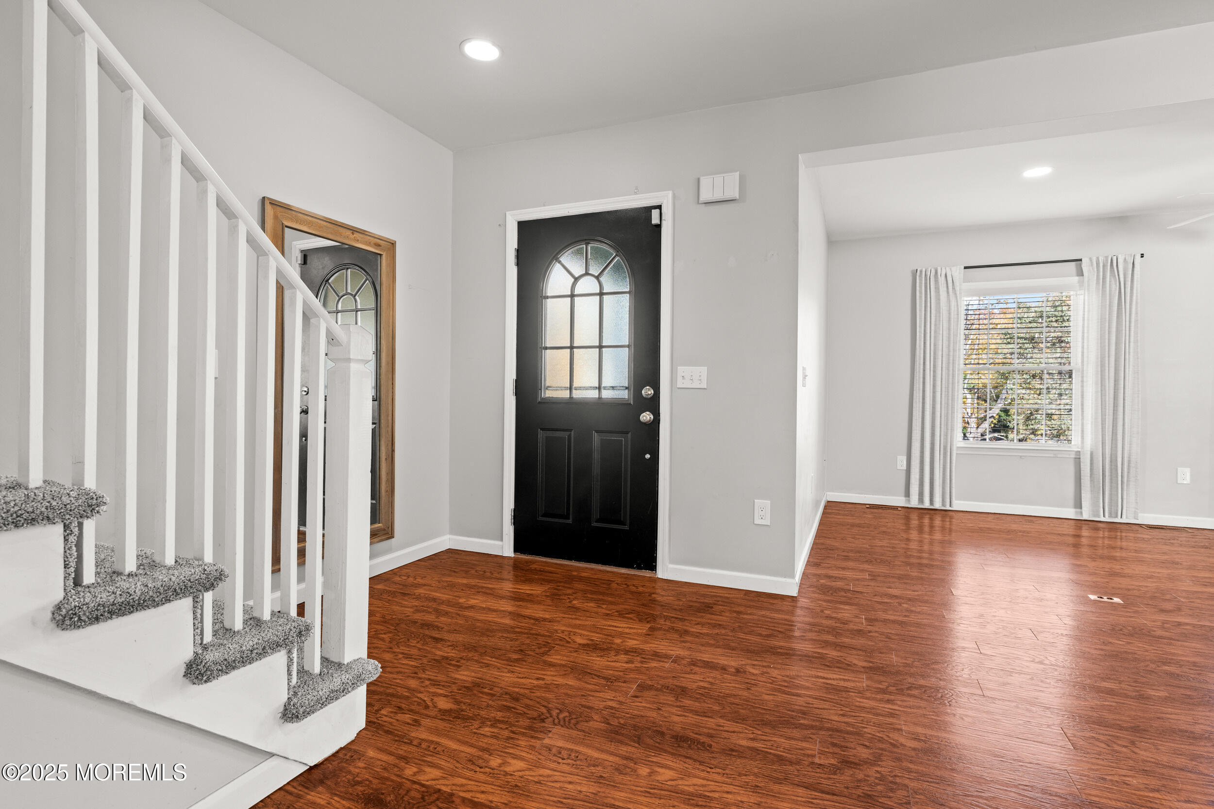 603 West Farms Road Howell, NJ 07731 - Photo 6 of 38 a view of livingroom with hardwood floor and hallway