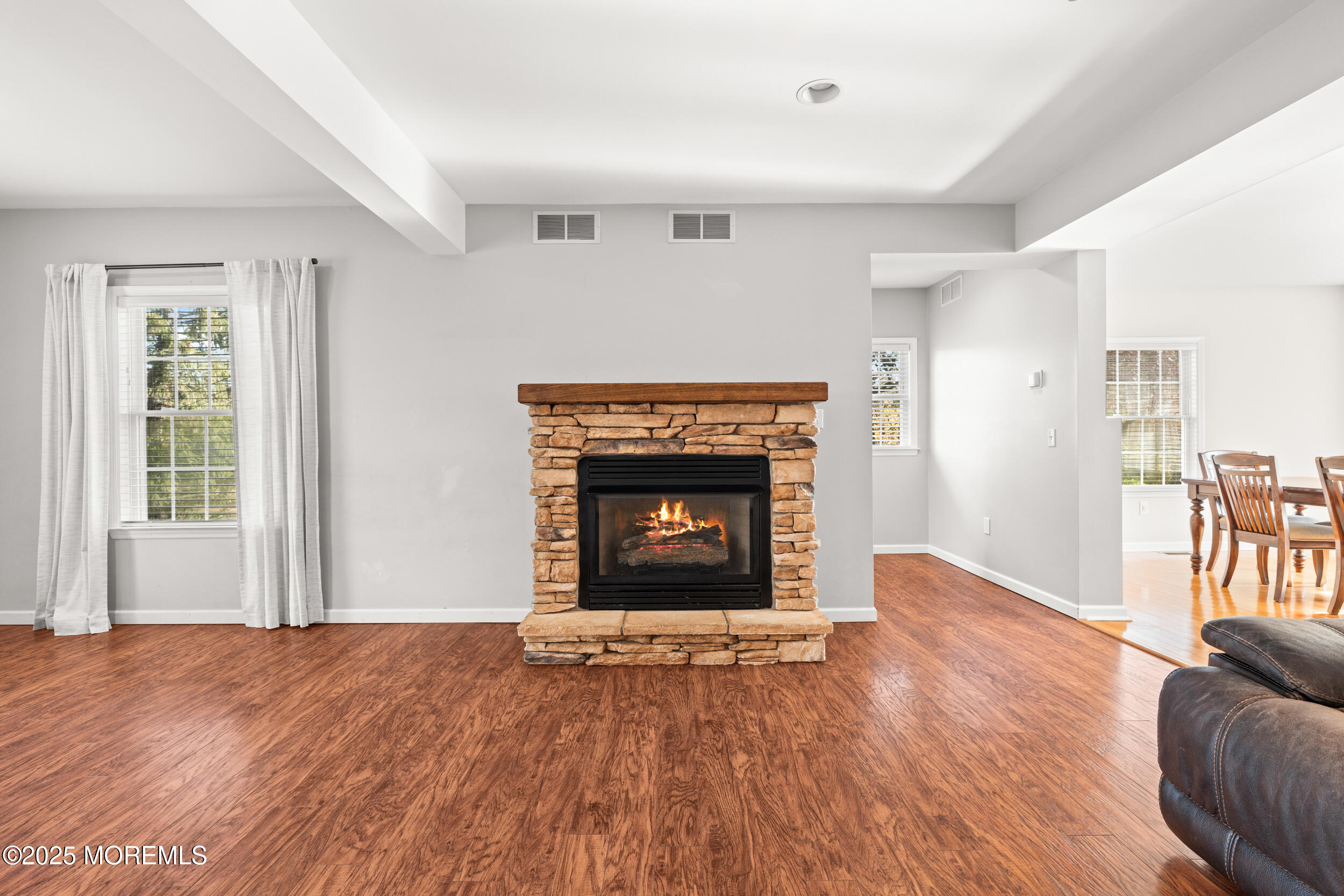 603 West Farms Road Howell, NJ 07731 - Photo 8 of 38 a view of an empty room with window and fire place