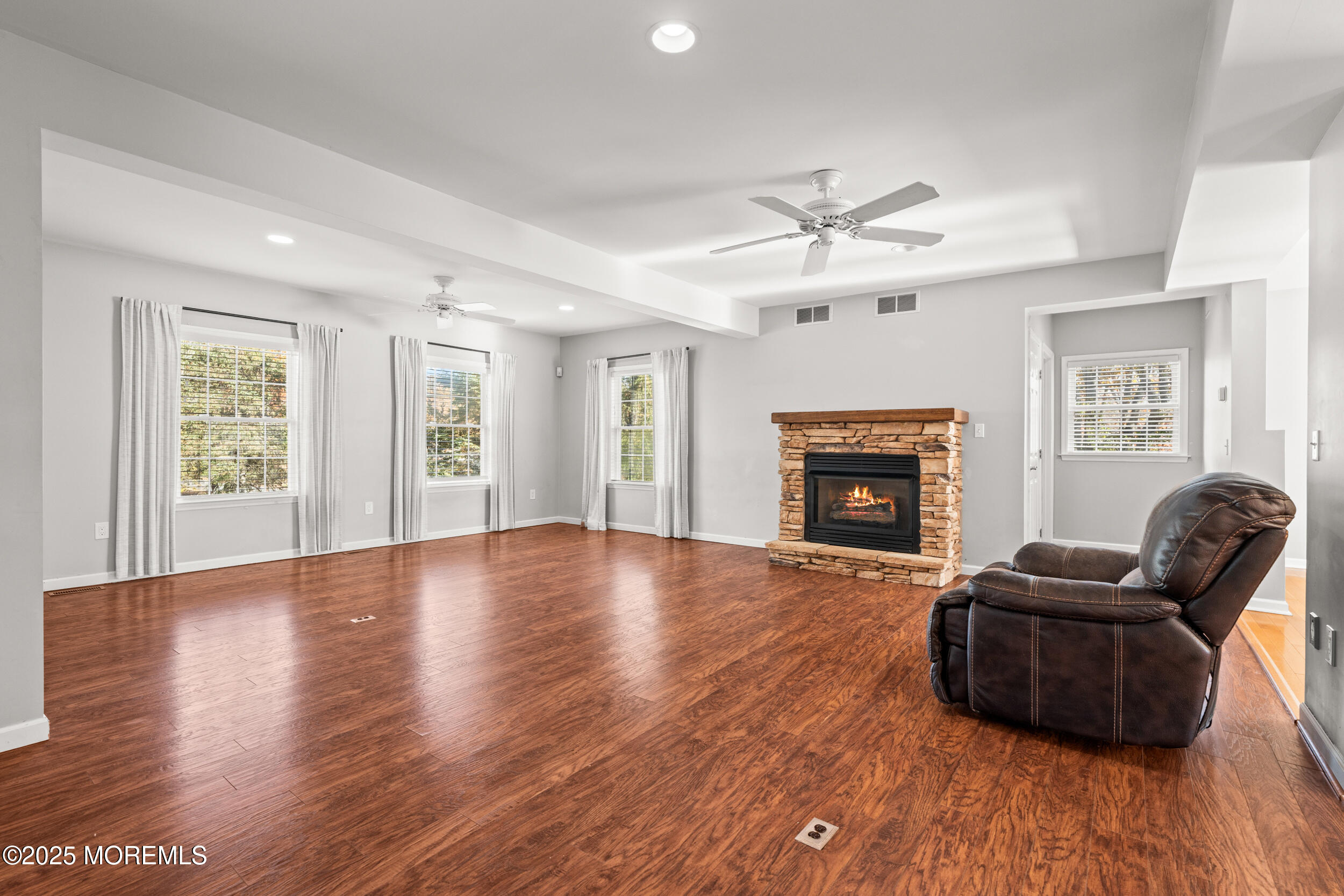 603 West Farms Road Howell, NJ 07731 - Photo 9 of 38 a living room with furniture and a fireplace