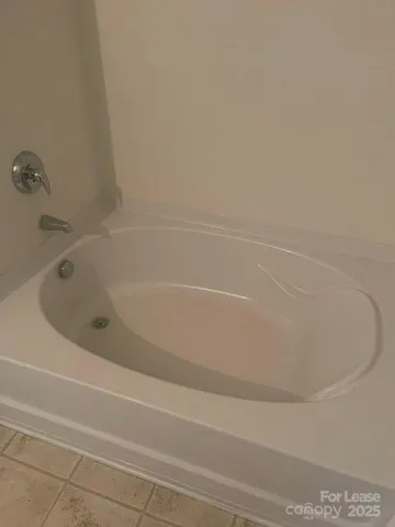 a close view of a bathtub in a bathroom