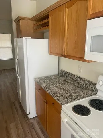 a kitchen with a sink and a refrigerator