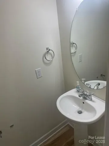 a bathroom with a sink and mirror