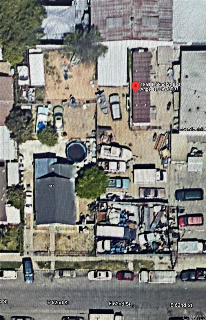 an aerial view of houses with street