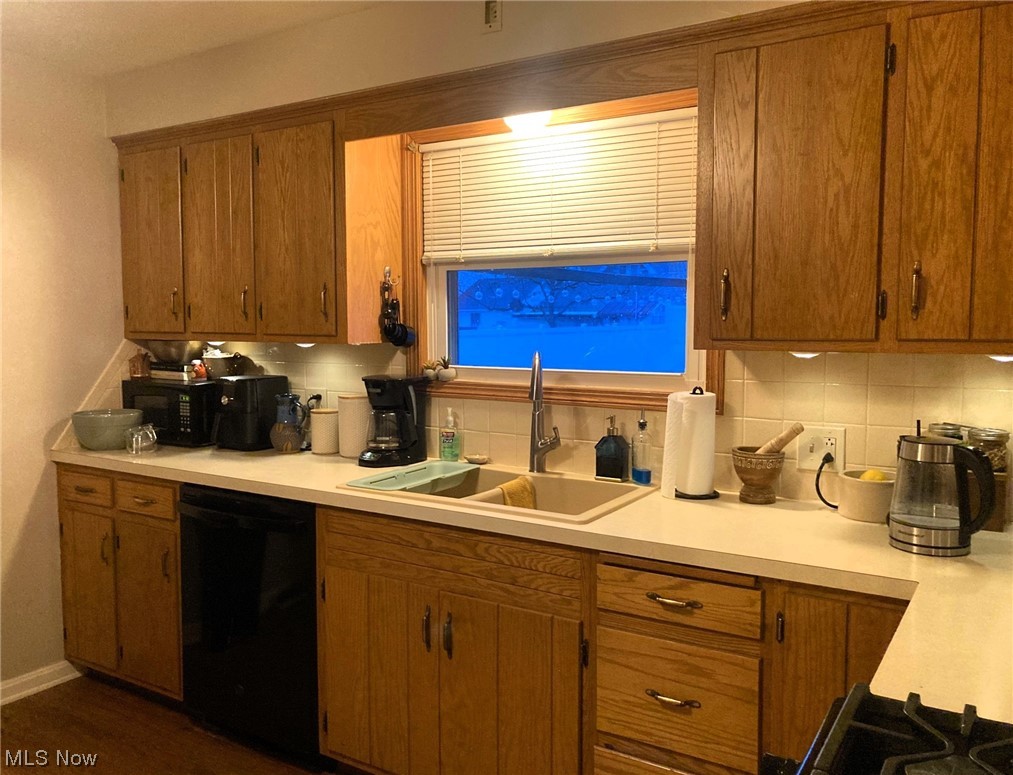 233 Raff Road Northwest Canton, OH 44708 - Photo 9 of 24 Kitchen with tasteful backsplash, nice countertop space