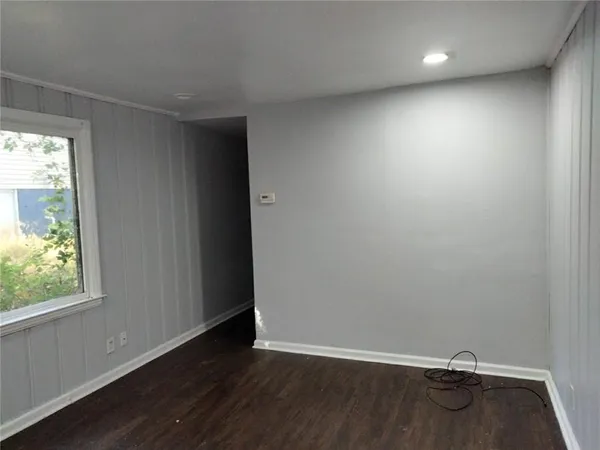 a kitchen with granite countertop a sink stove and refrigerator