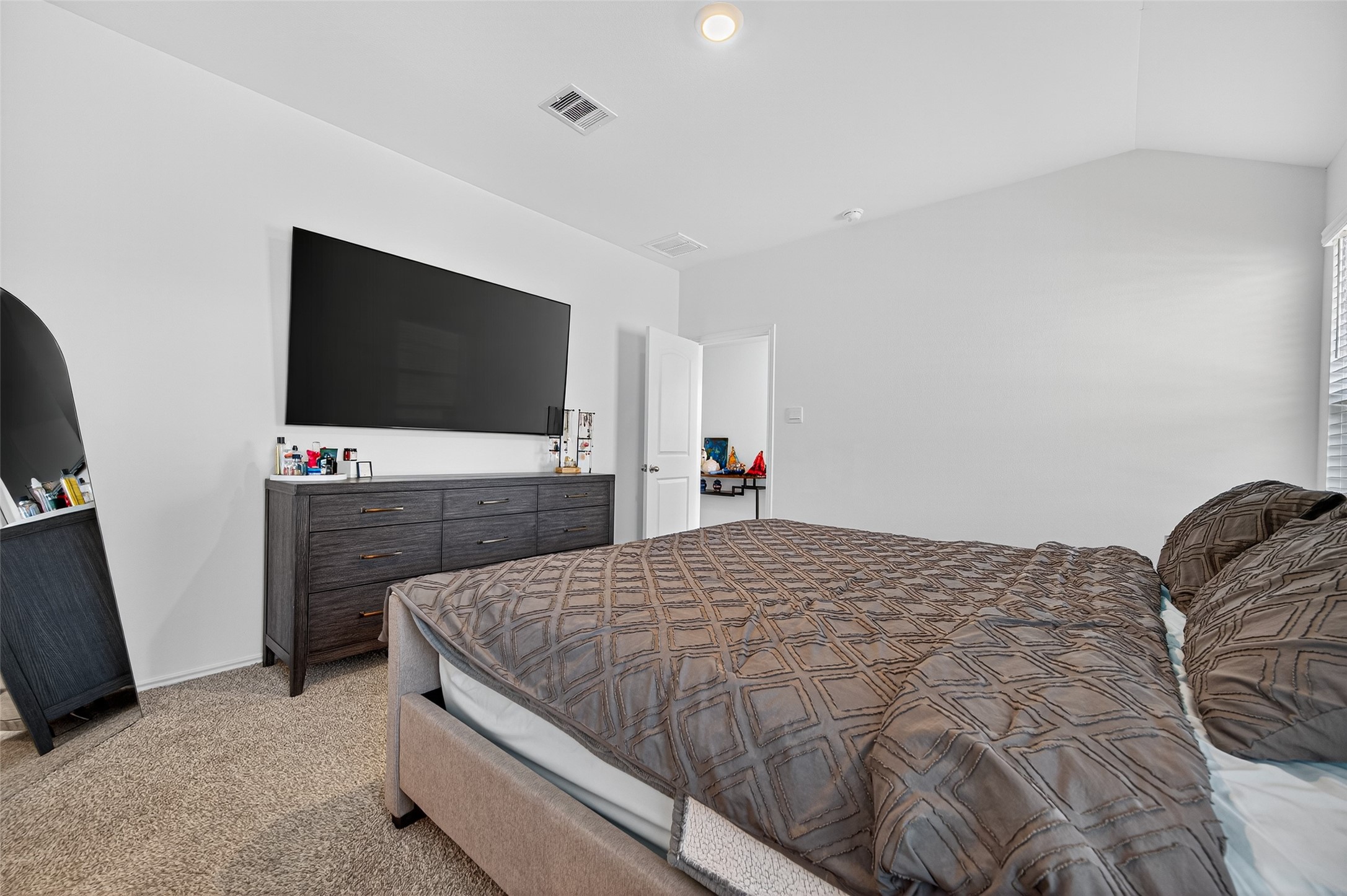 5323 Pinecliff Grove Court Spring, TX 77373 - Photo 19 of 41 a bedroom with a bed and a flat screen tv