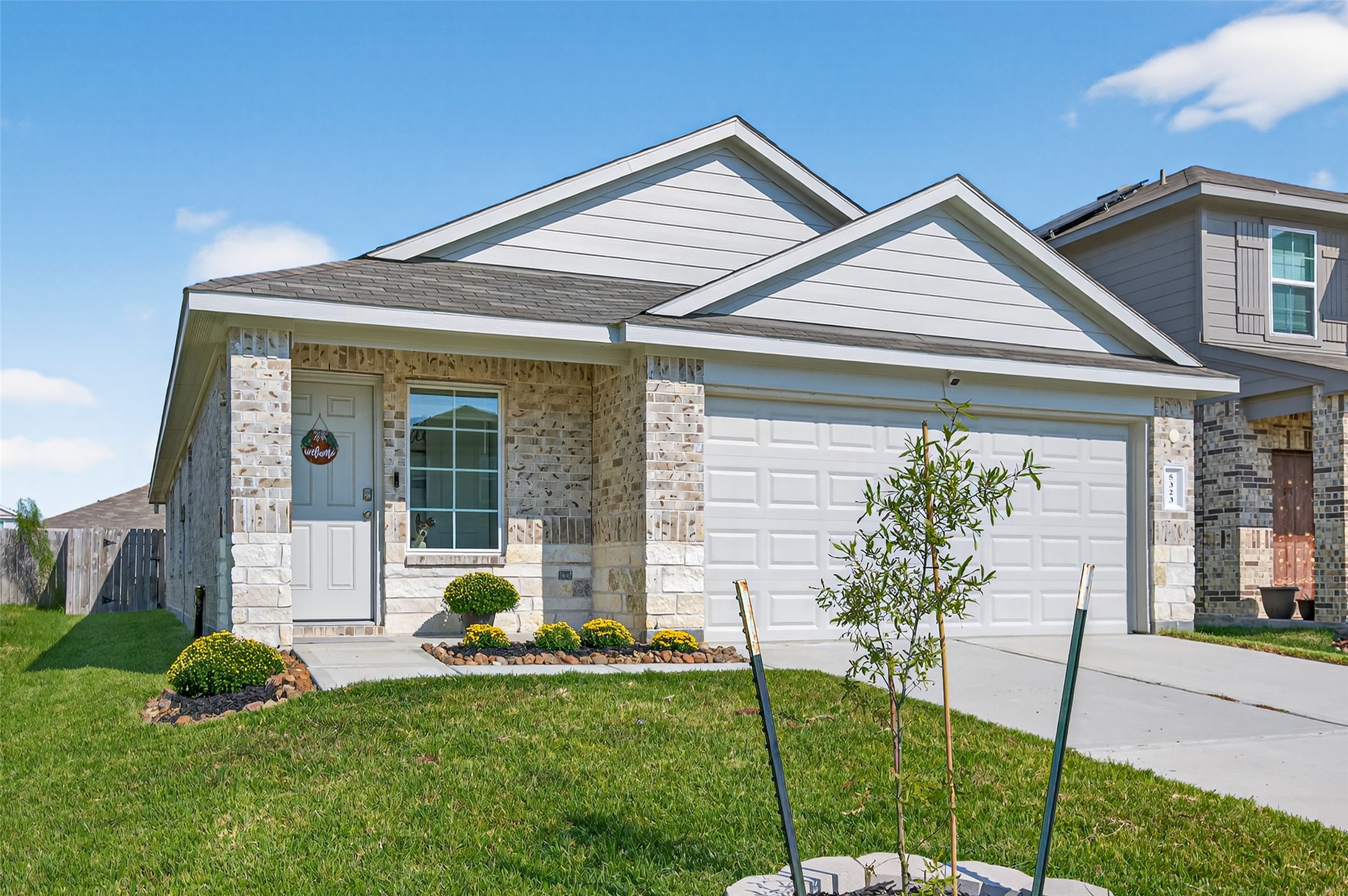 5323 Pinecliff Grove Court Spring, TX 77373 - Photo 2 of 41 a front view of a house with a garden and plants