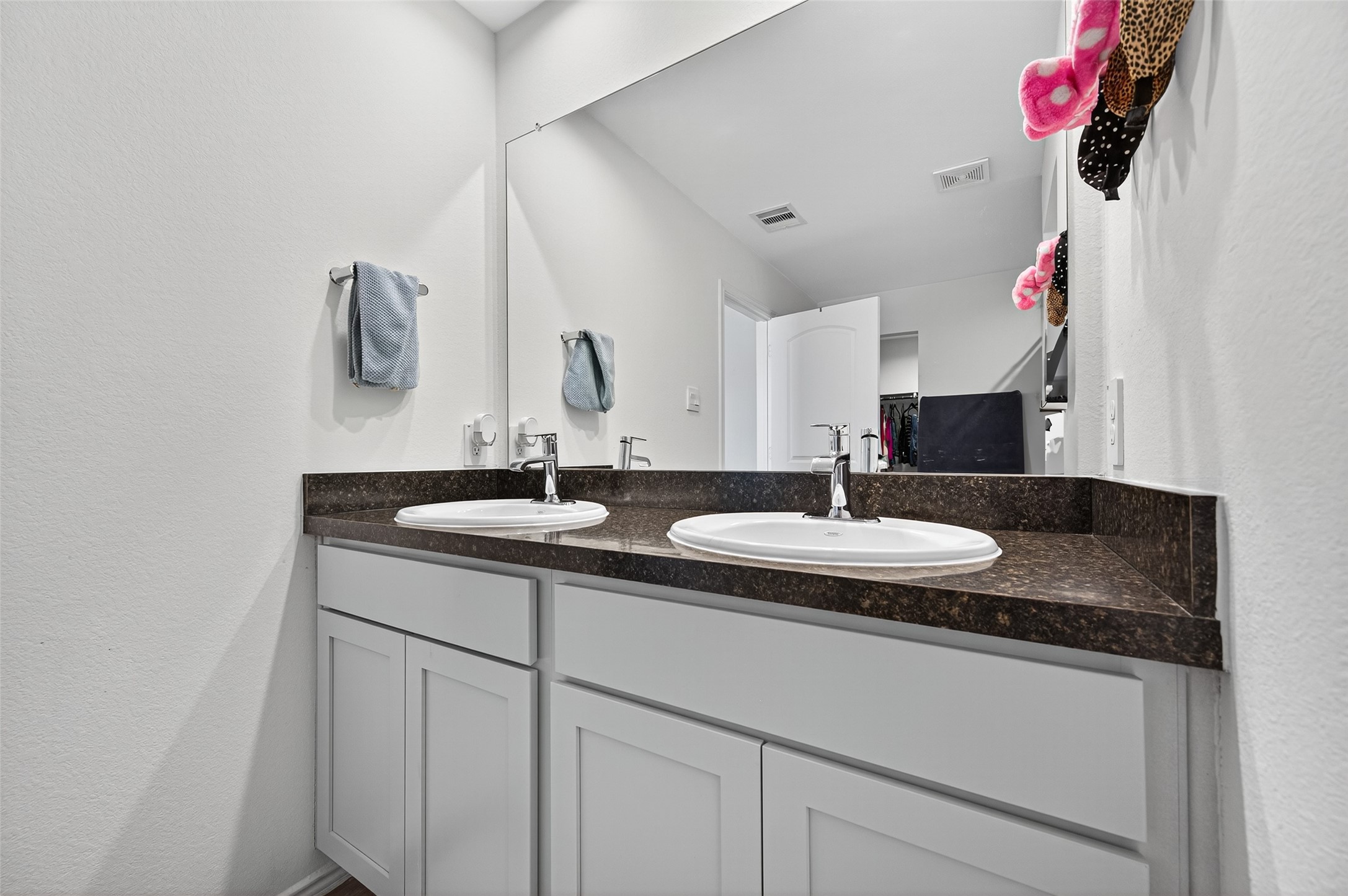 5323 Pinecliff Grove Court Spring, TX 77373 - Photo 21 of 41 a bathroom with a granite countertop sink and a mirror