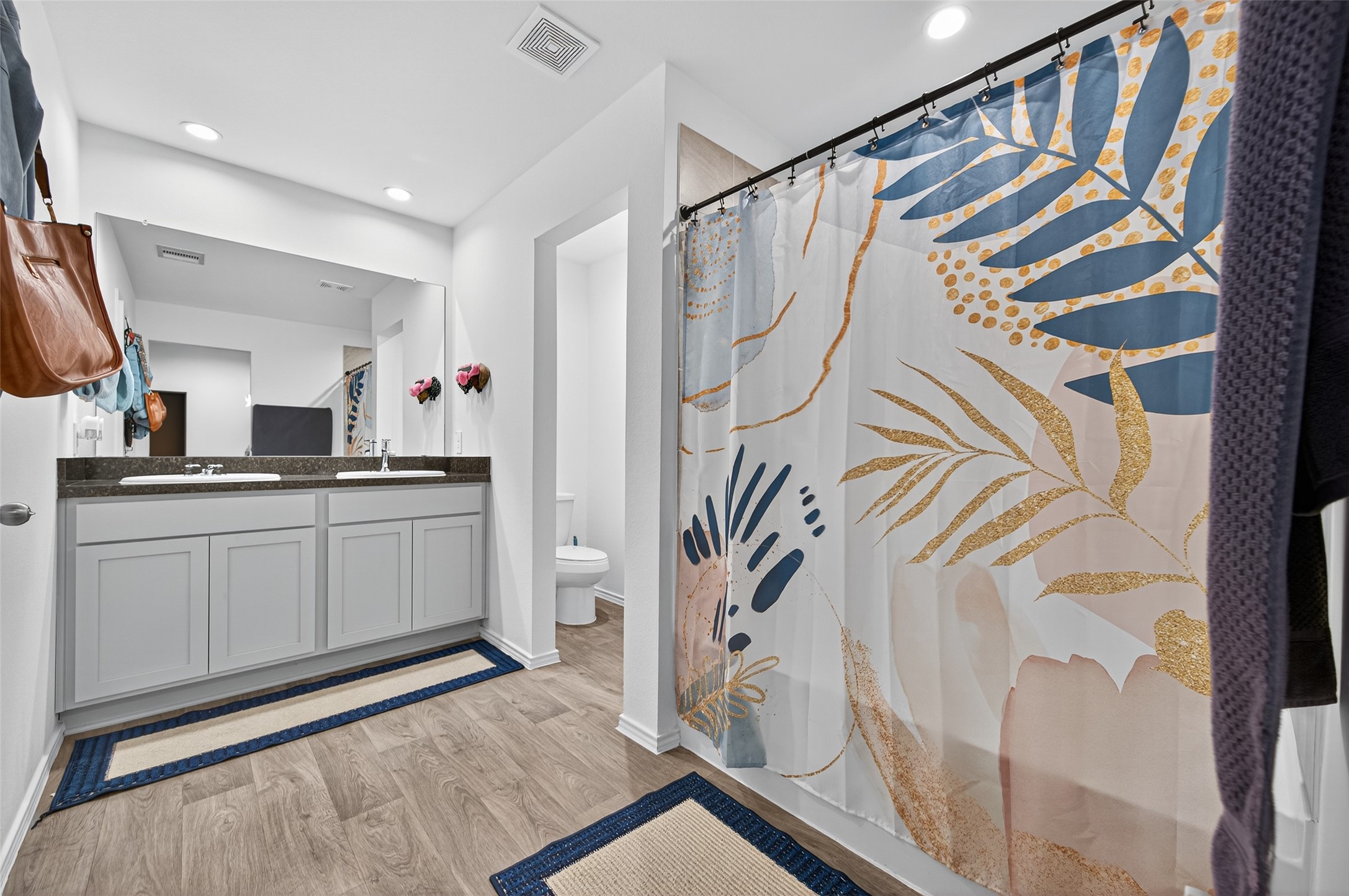 5323 Pinecliff Grove Court Spring, TX 77373 - Photo 23 of 41 a bathroom with a sink a mirror and a shower