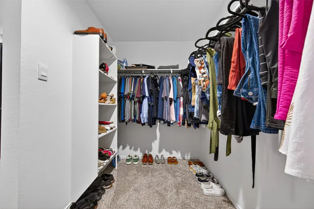 a bedroom with a bed and a desk