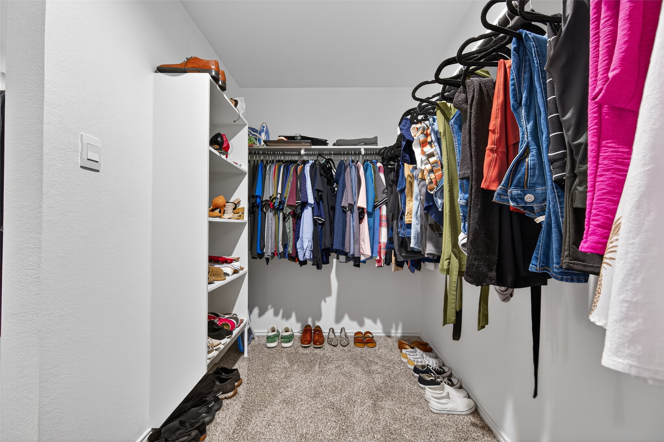5323 Pinecliff Grove Court Spring, TX 77373 - Photo 24 of 41 a view of walk in closet with clothes and shoes