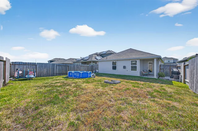 a sign that is in front of flowers