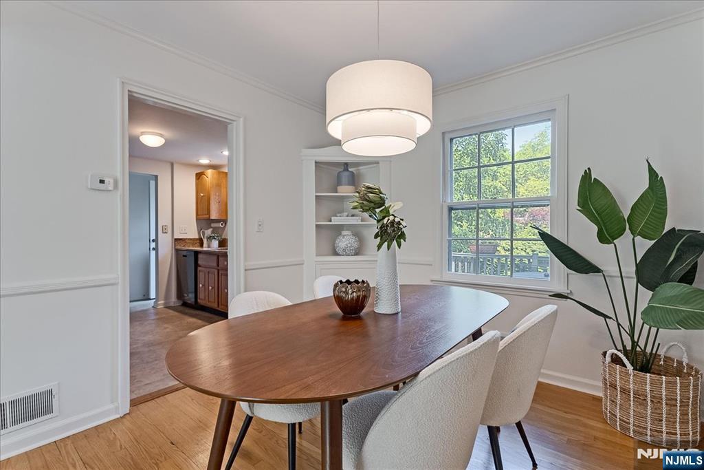 687 Grove Street Montclair, NJ 07043 - Photo 5 of 18 a view of a dining room with furniture window and wooden floor