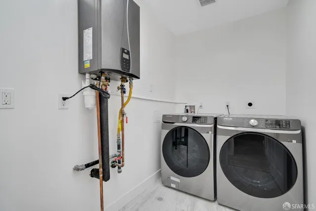 a kitchen with granite countertop a stove sink and cabinets