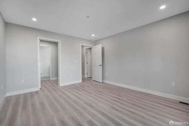 a view of a dining room with furniture wooden floor and a floor to ceiling window