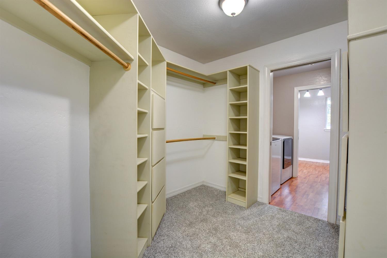 650 Onion Mountain Road Wilderville, OR 97543 - Photo 19 of 34 a view of walk in closet with empty racks