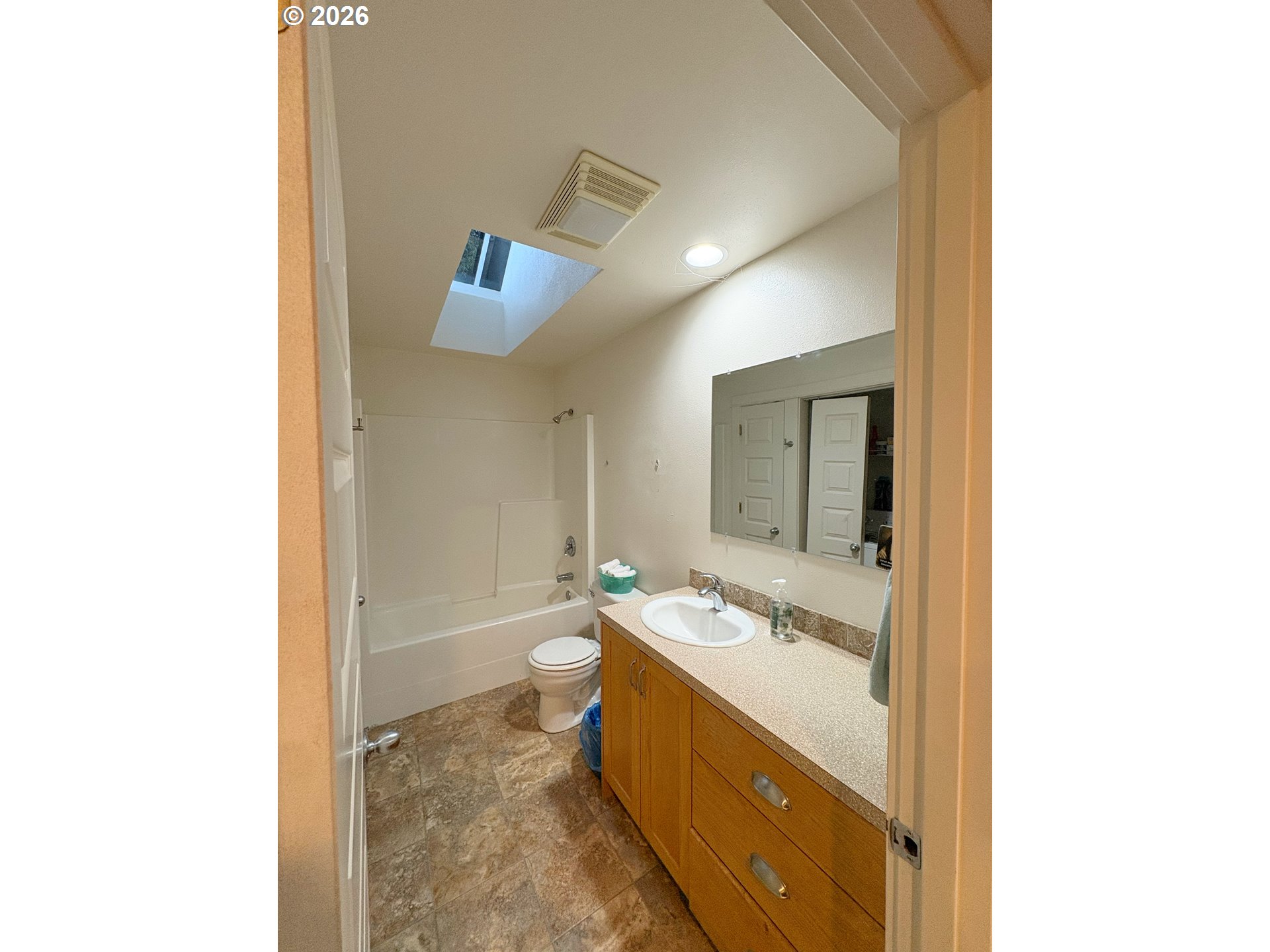 2090 Minnesota Street Eugene, OR 97402 - Photo 33 of 39 a bathroom with a double vanity sink toilet mirror and bathtub