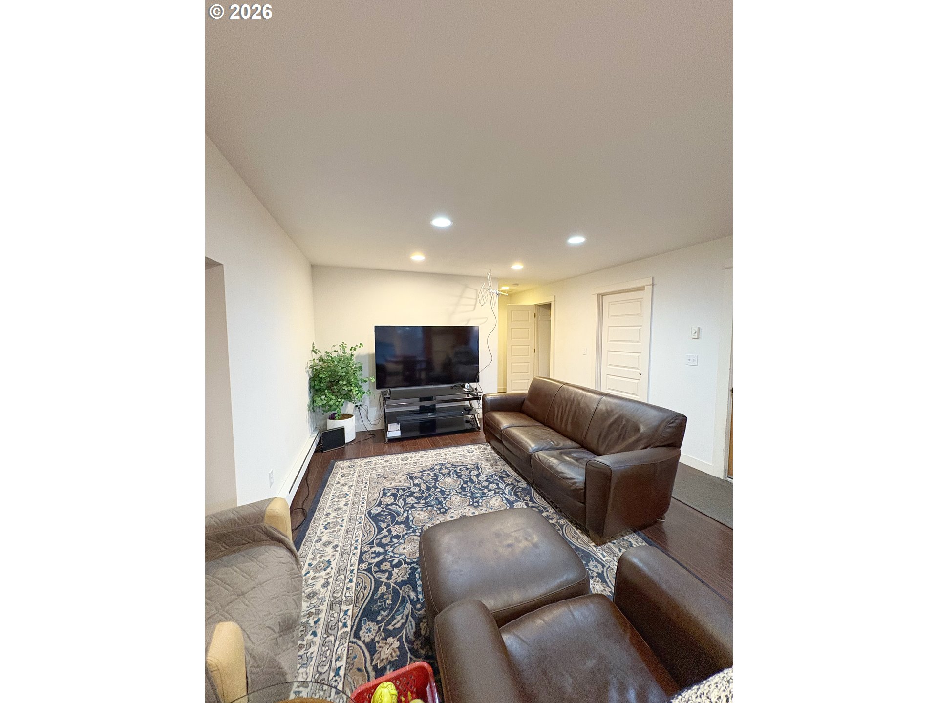 2090 Minnesota Street Eugene, OR 97402 - Photo 36 of 39 a living room with furniture and a flat screen tv