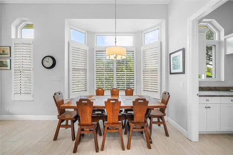 a bedroom with a bed dresser and a window