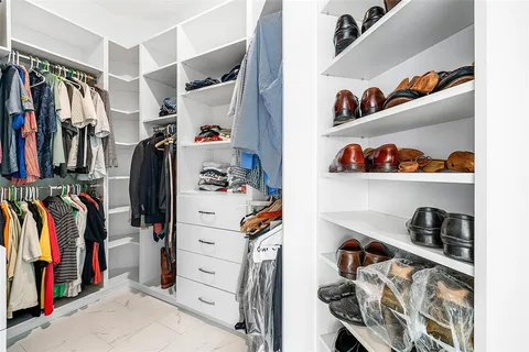 a bedroom with a bed dresser and a window