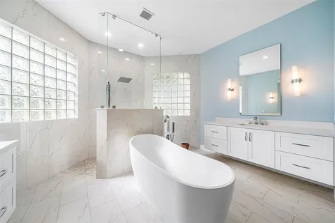 a view of a livingroom with workspace and a window