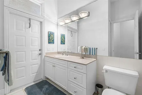 a view of an empty room with a window and a fireplace