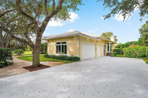 a view of a house with a small yard